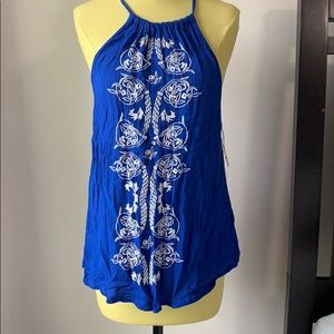 Blue and white embroidered top.